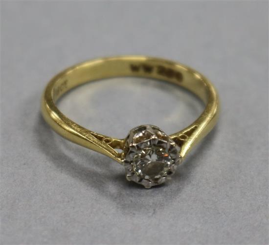 An 18ct gold and illusion set solitaire diamond ring, size O.